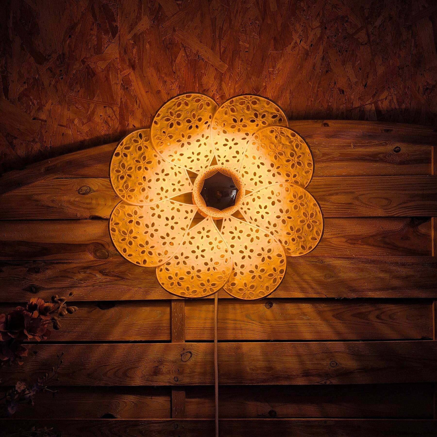 Wall sconce with flower, rattan petals and pastel yellow eyelet embroidery