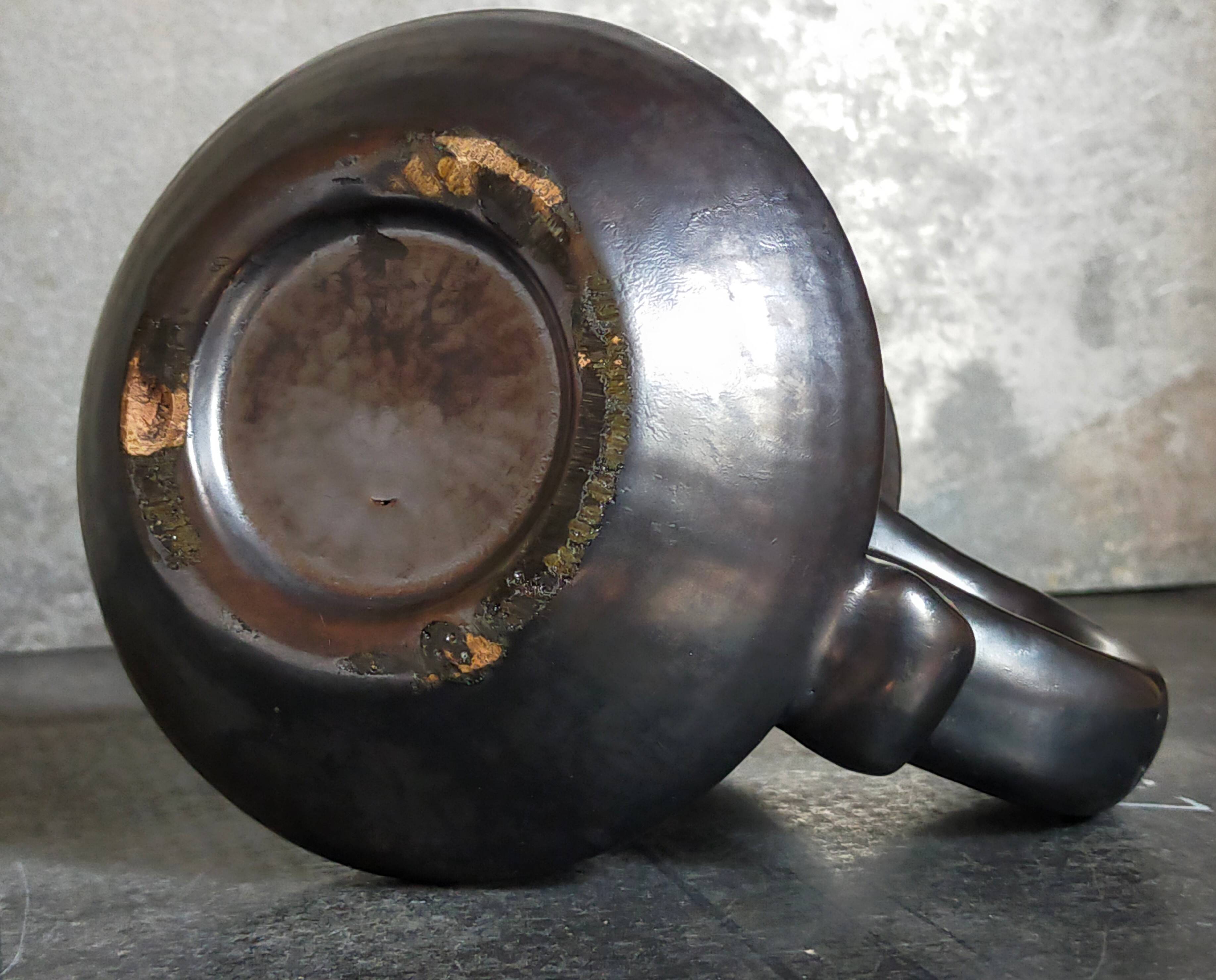 1950s iridescent black ceramic hand candle holder