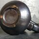 1950s iridescent black ceramic hand candle holder