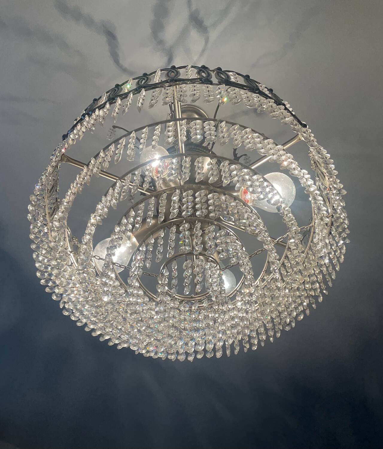 Cascading chandelier with crystal and silvered bronze pendants
