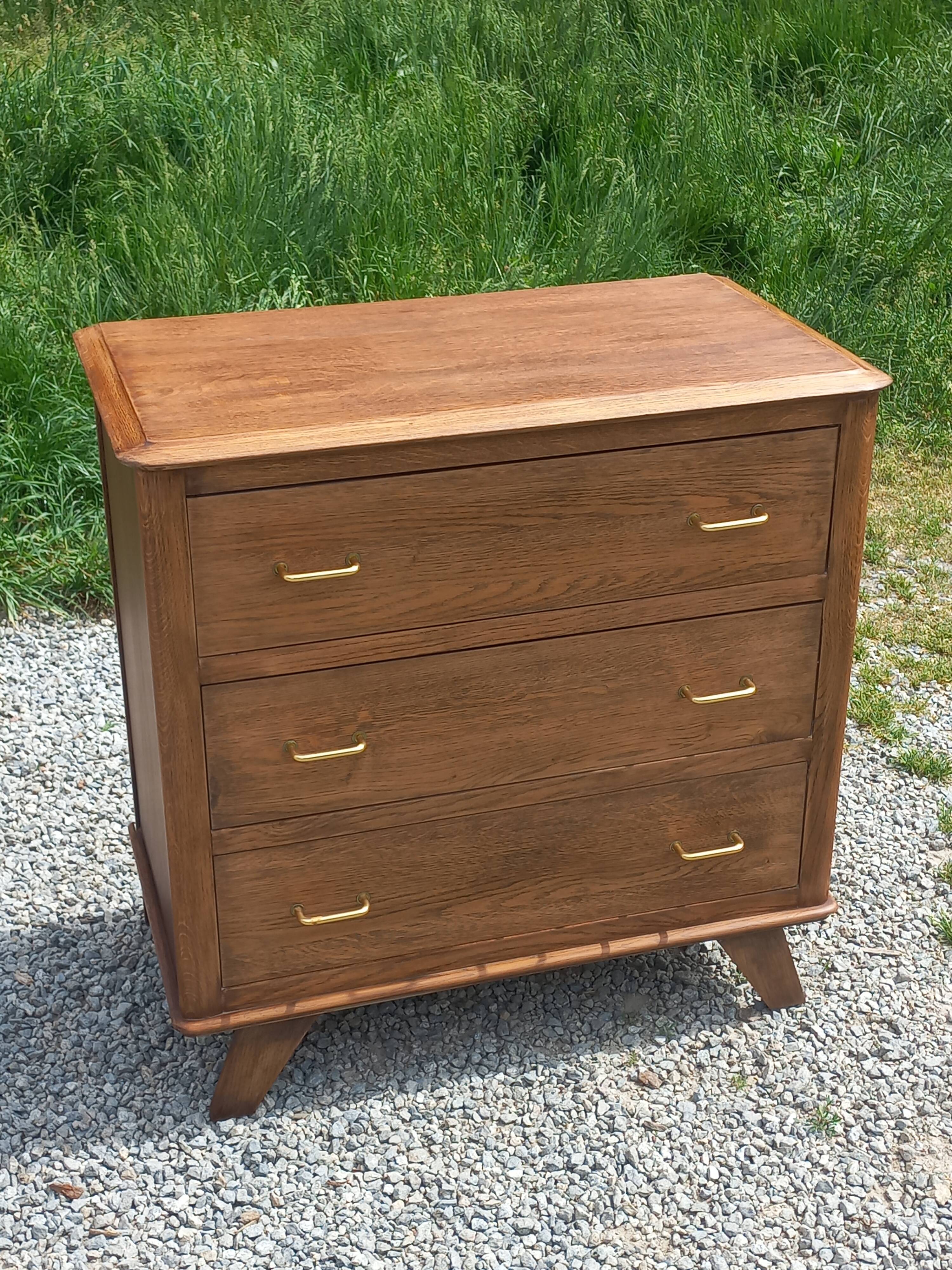 Vintage oak commode with tapered legs from the 1950s.