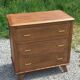 Vintage oak commode with tapered legs from the 1950s.