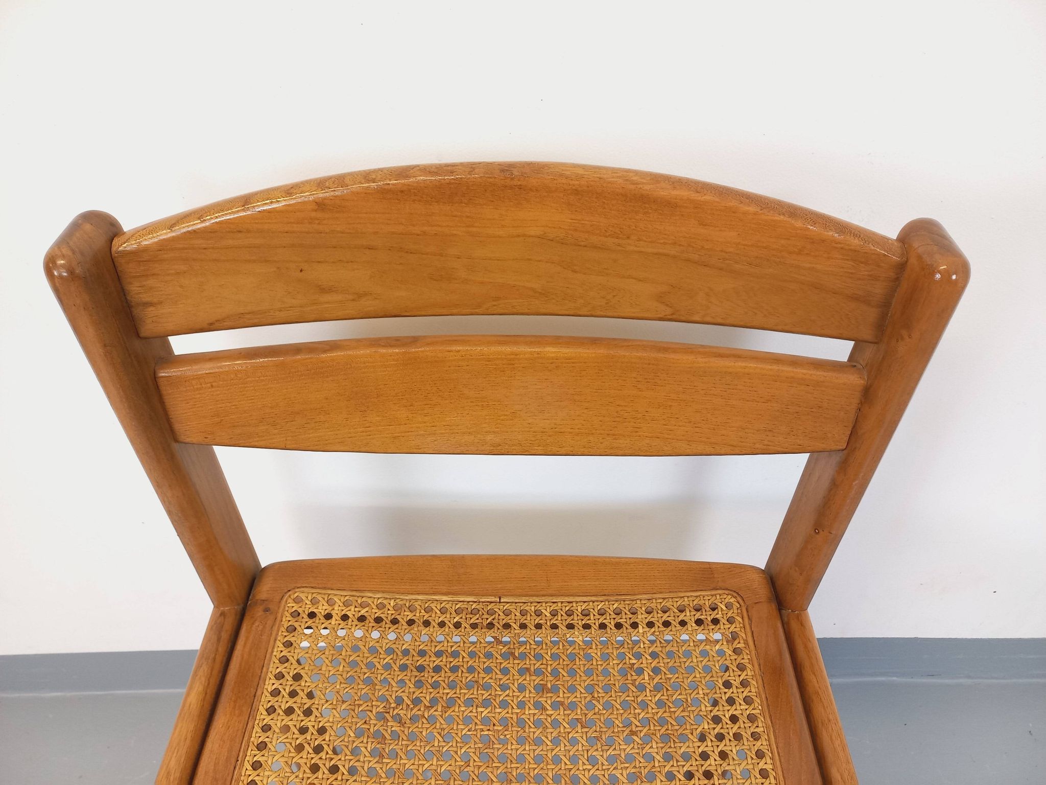 Vintage sleigh chair in beech wood and cane from the 70s and 80s