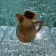 Large vintage artisanal glazed earthenware pitcher with pinched spout