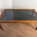 Large Scandinavian coffee table in teak and smoked glass.