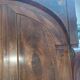A walnut wardrobe with marquetry and boxwood stringing, dating from the Consulate period, circa 1810.