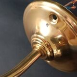 Brass and frosted glass wall lights