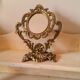 Baroque oval mirror pivoting on foot Golden brass 20x15cm