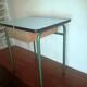 Child in formica desk