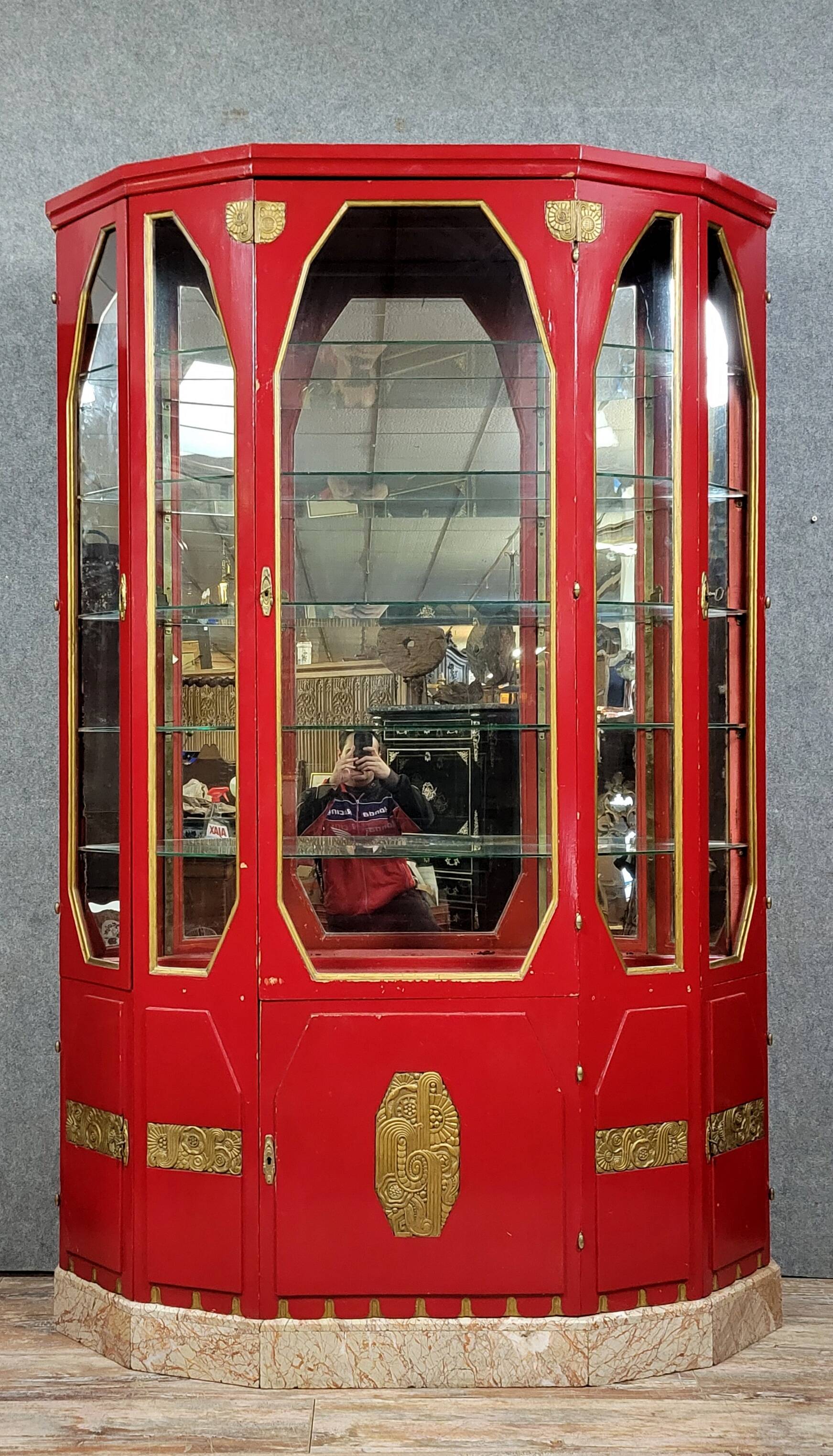 Important Art Deco period bookcase in lacquered wood and gilded bronze