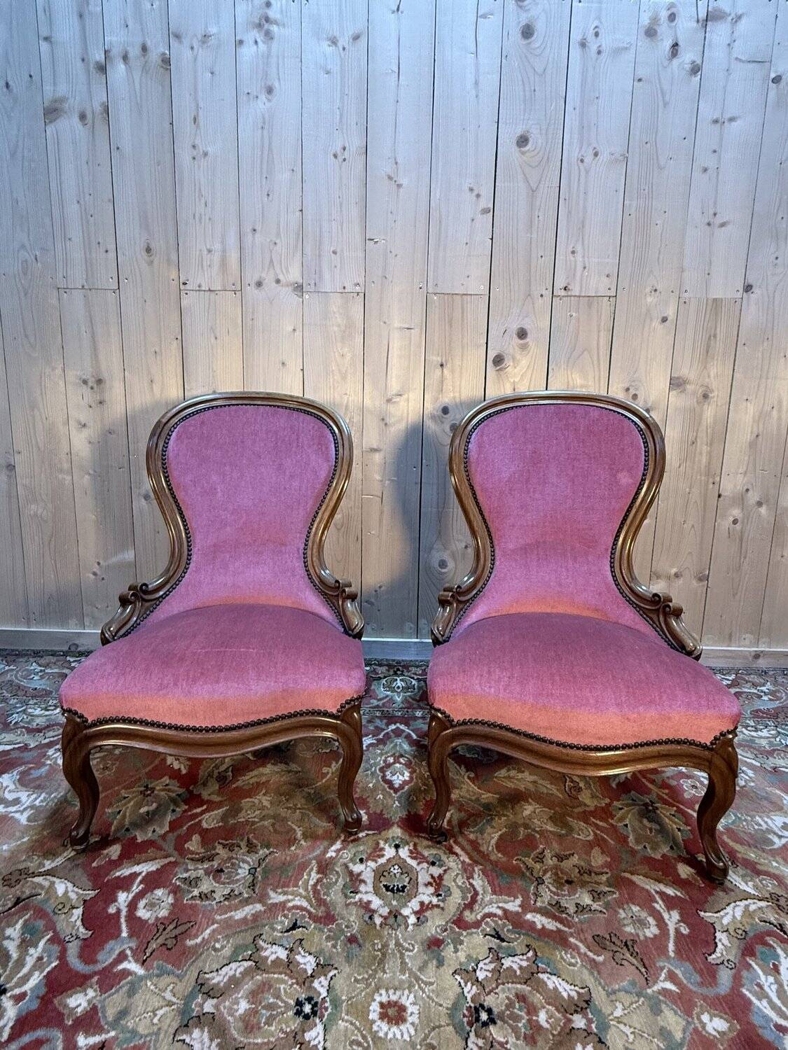 Pair of Louis Philippe armchairs in walnut and pink velvet.