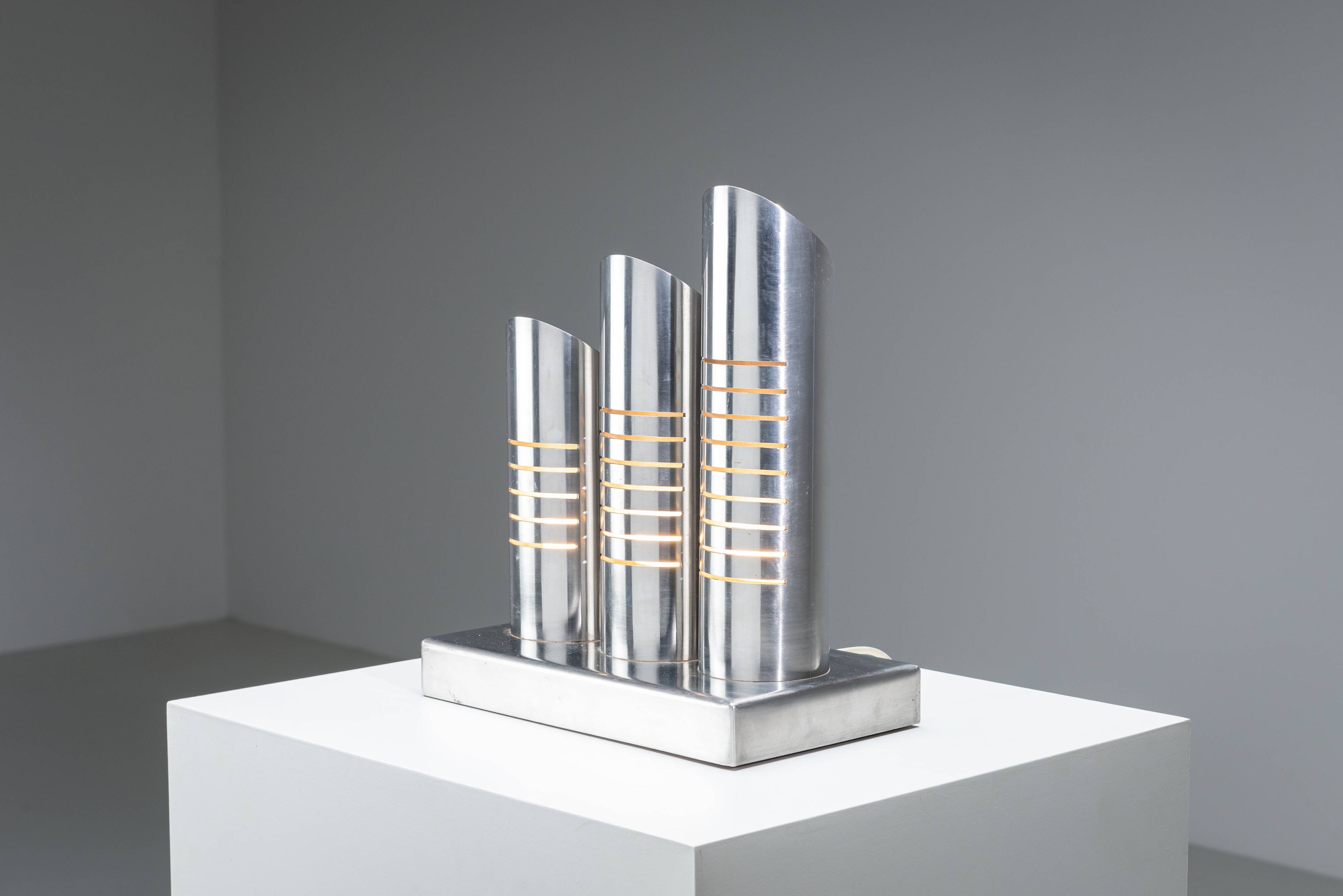 Triple column table lamp in stainless steel by Goffredo Reggiani