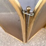 Antique brass fireplace screen from 1920, vintage spark guard.