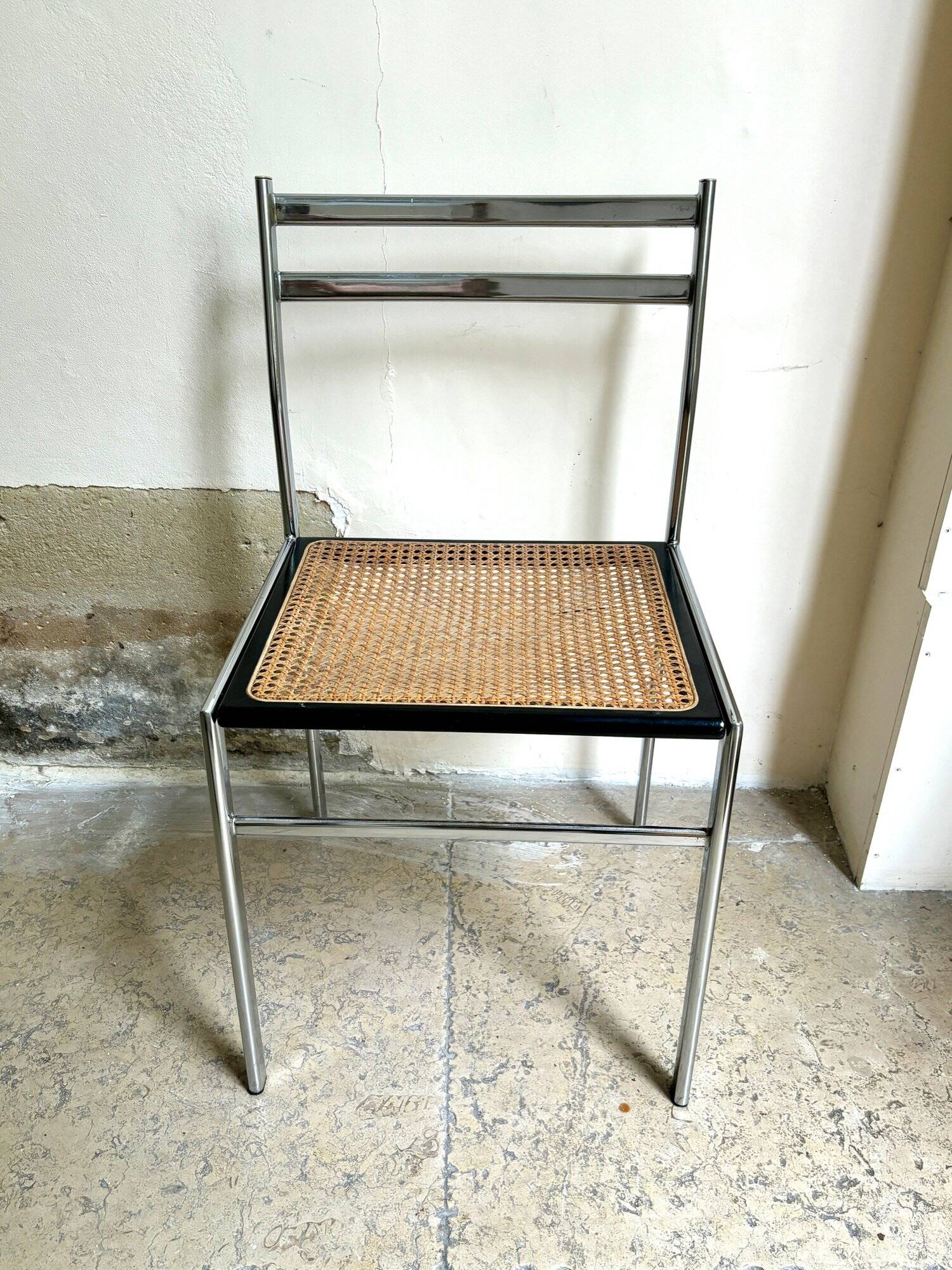 Chair in chrome metal, black wood and canework