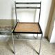 Chair in chrome metal, black wood and canework