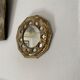 Antique mirror in worked brass