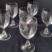 6 vintage wine glasses with baluster stems and engraved decoration on the bowl.