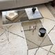 Set of 2 vintage nesting coffee tables in chrome metal and smoked glass.
