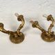 Pair of gilded wooden wall lights with two arms, early 20th century.