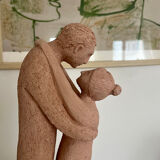 Terracotta sculpture of an entwined couple.