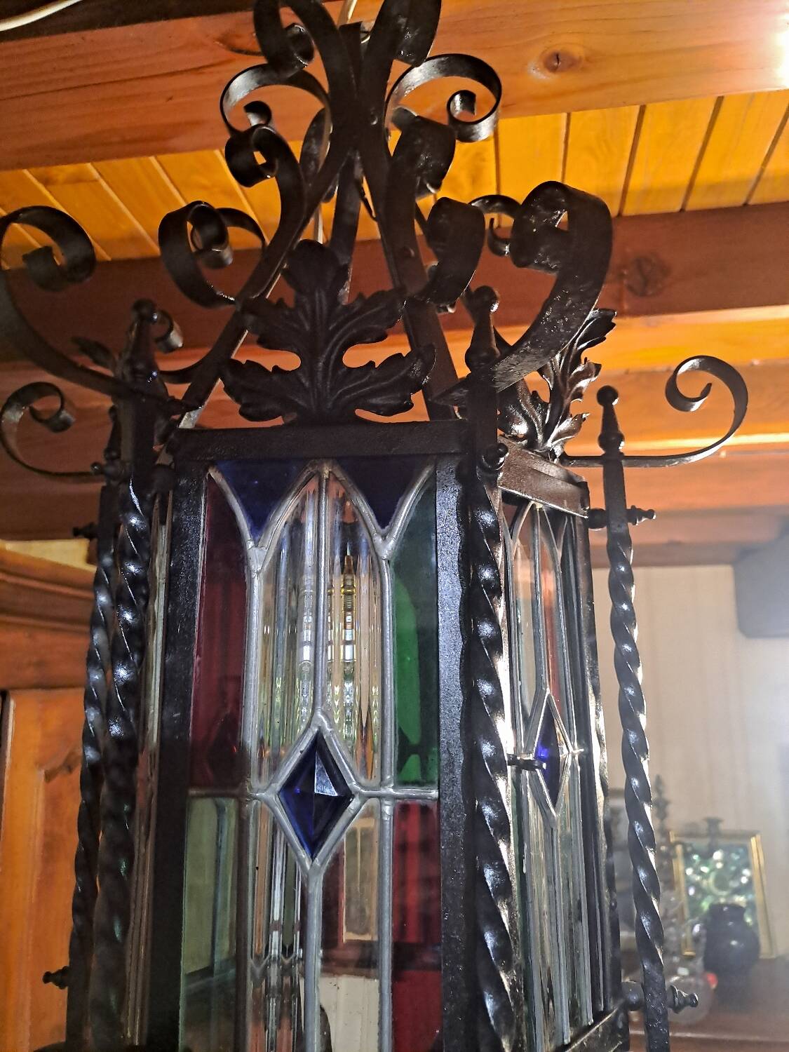 Wrought iron lantern with colored stained glass