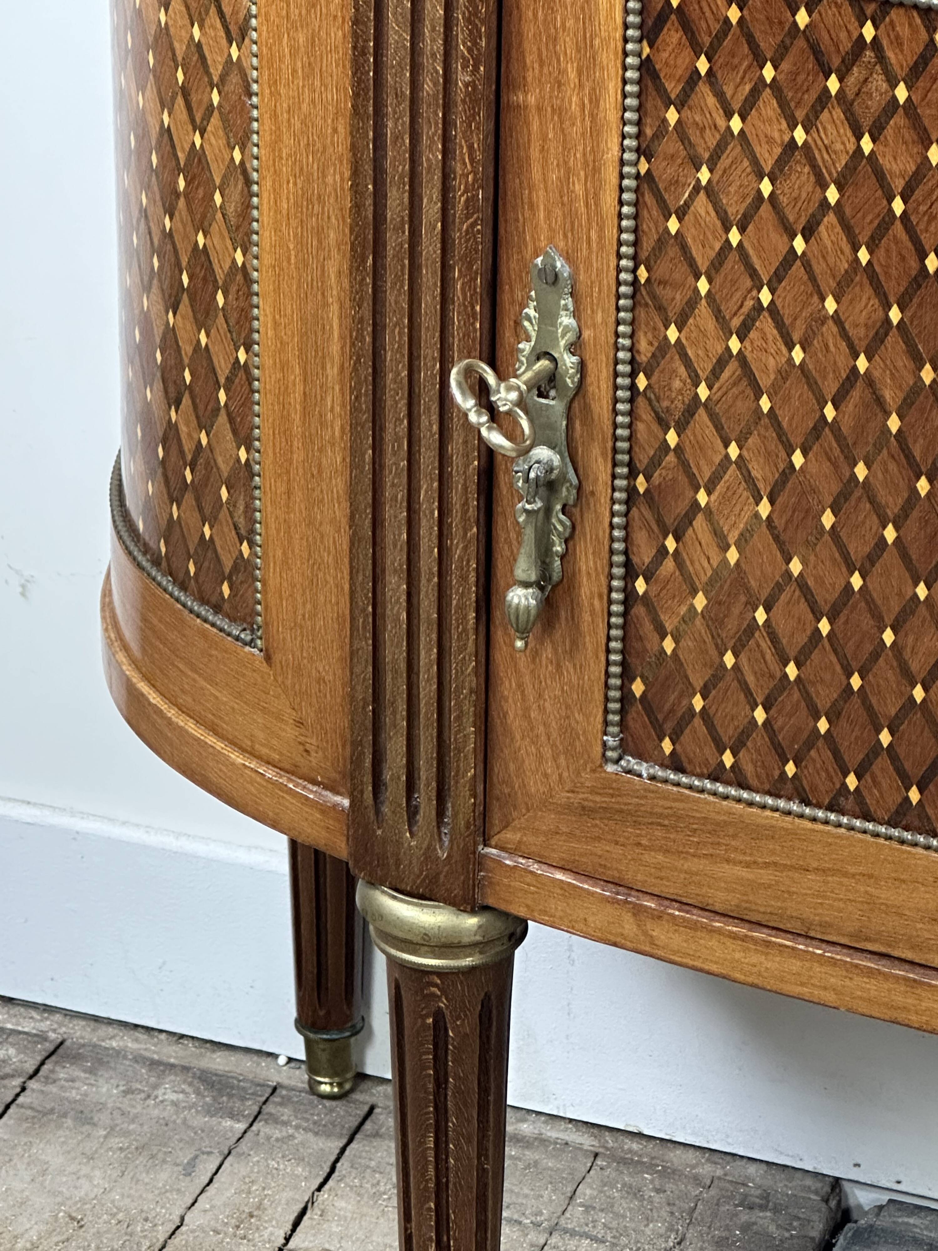 Half-moon commode in the Louis XVI style