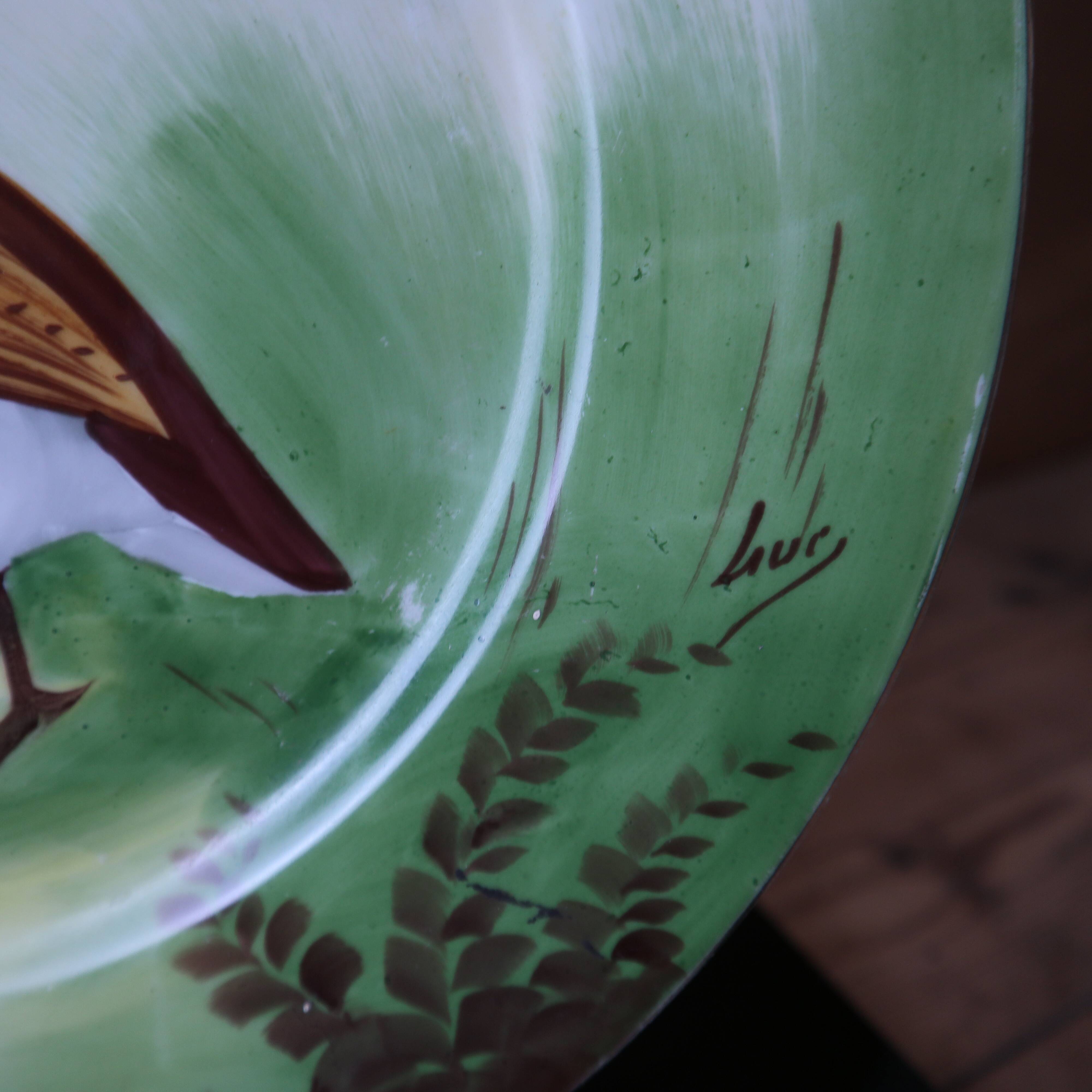 3 decorative porcelain plates from Limoges featuring partridges and pheasants.