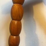 Round tripod stool in carved wood