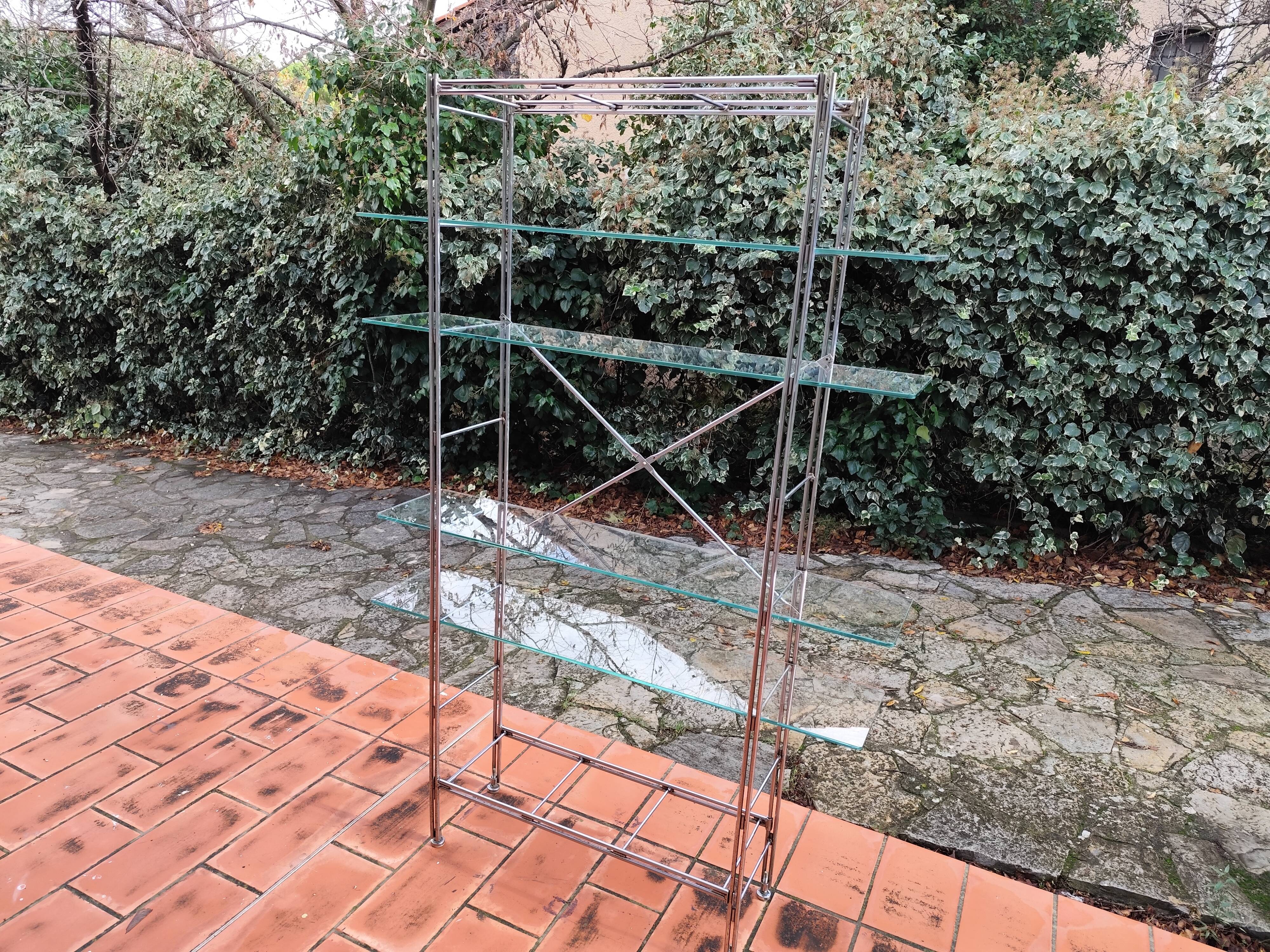 Modular metal chrome and vintage glass shelves from the 1970s.