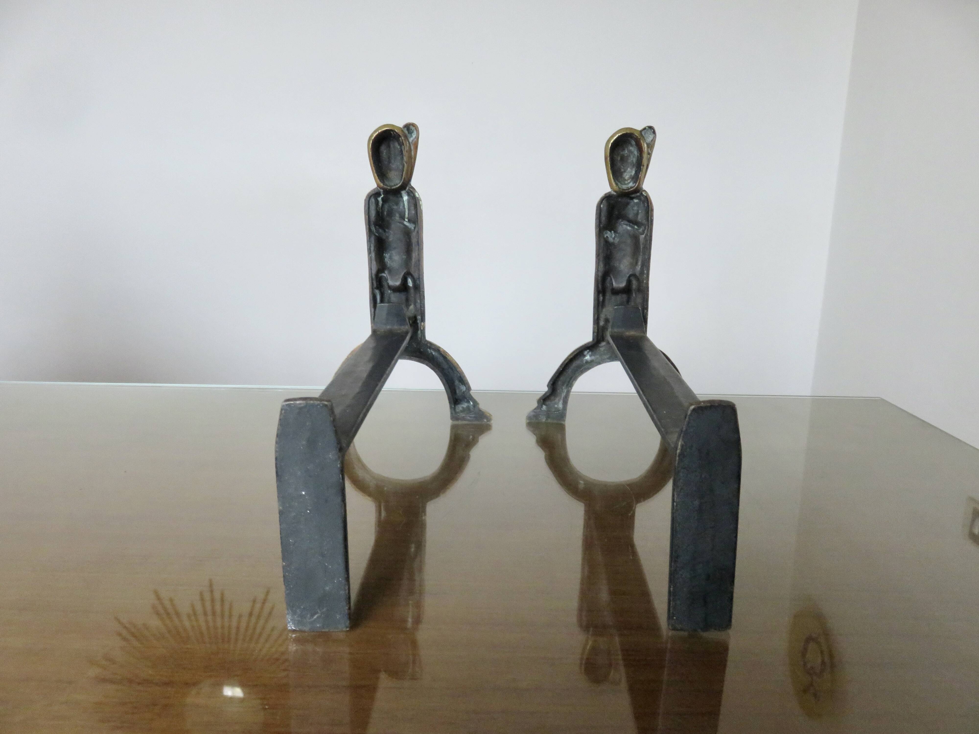 Anton Prinner, pair of Shaman fire dogs in gilded bronze, monogrammed, 1930