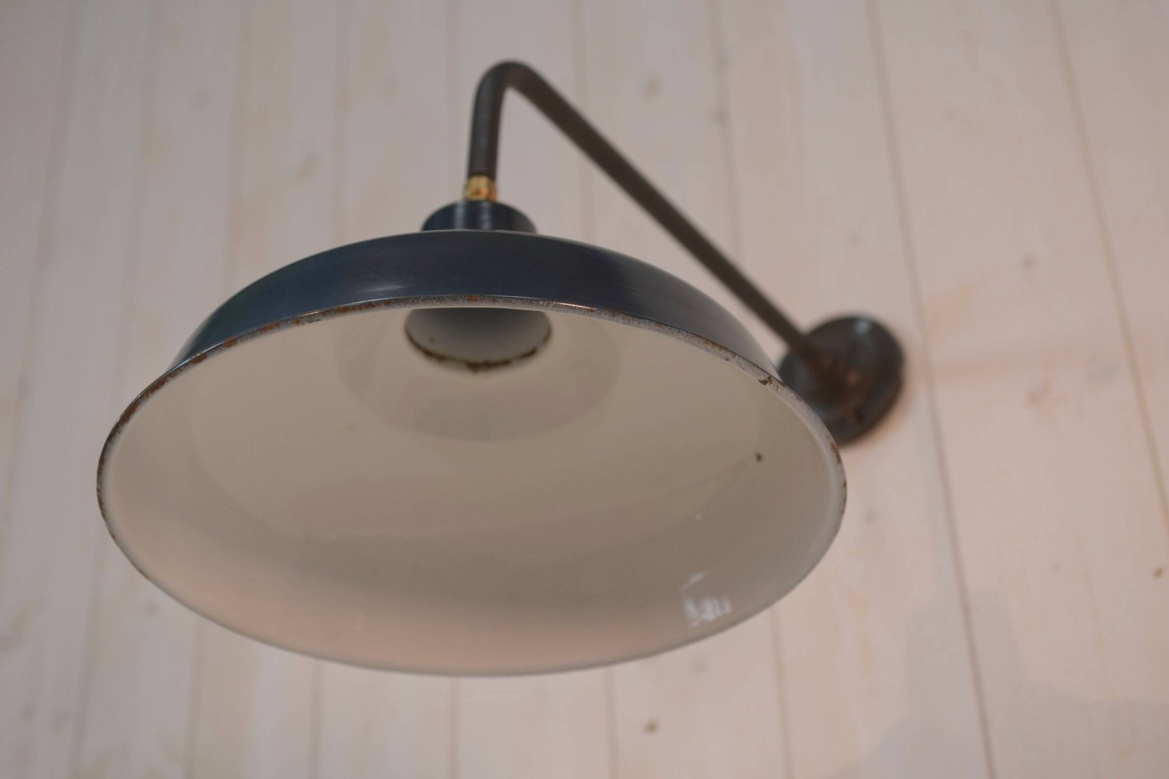 Antique cast iron wall bracket and enamelled globe, 1950s
