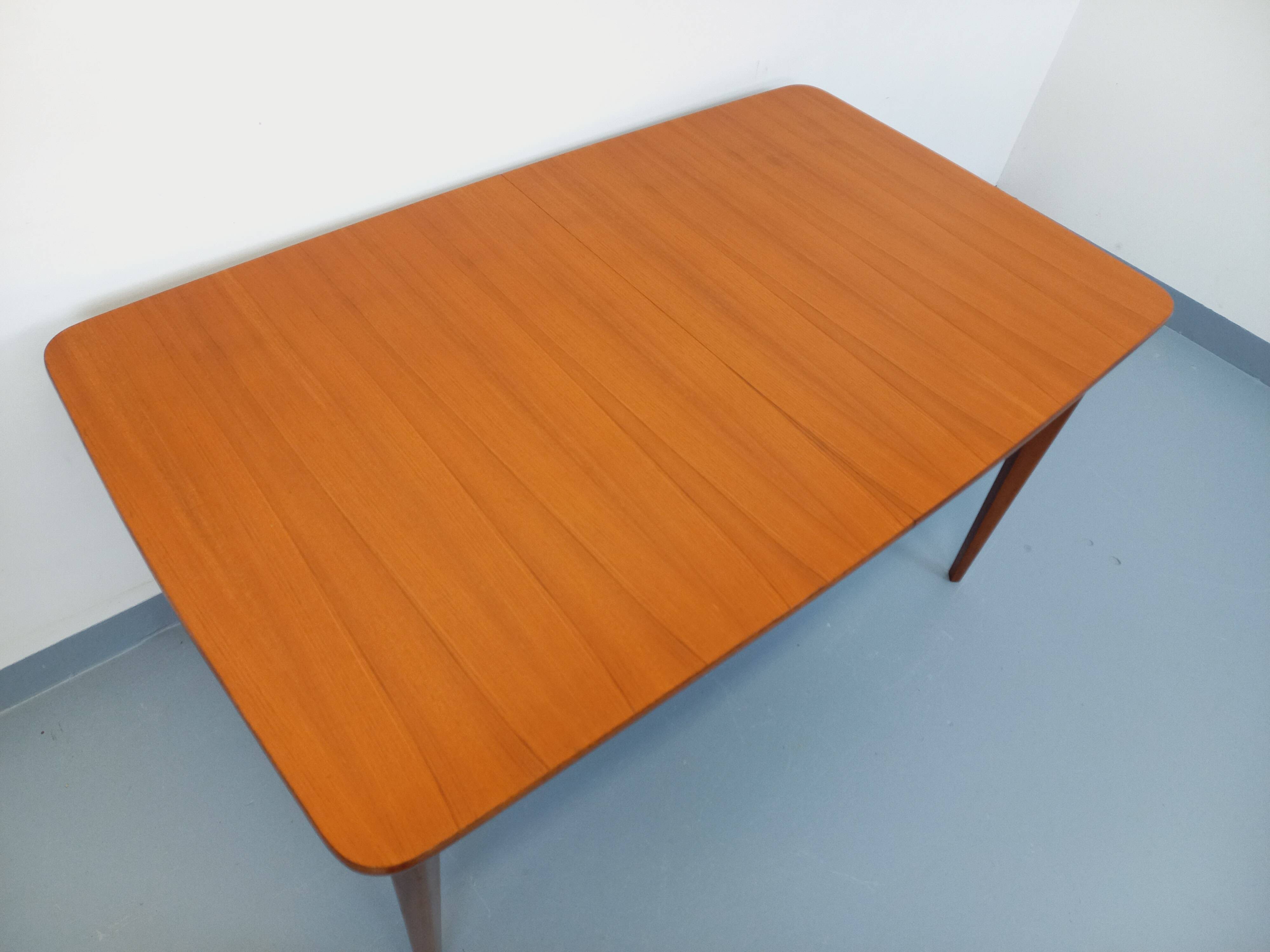 Rectangular dining table in vintage Scandinavian style from the 50s and 60s, made of teak.