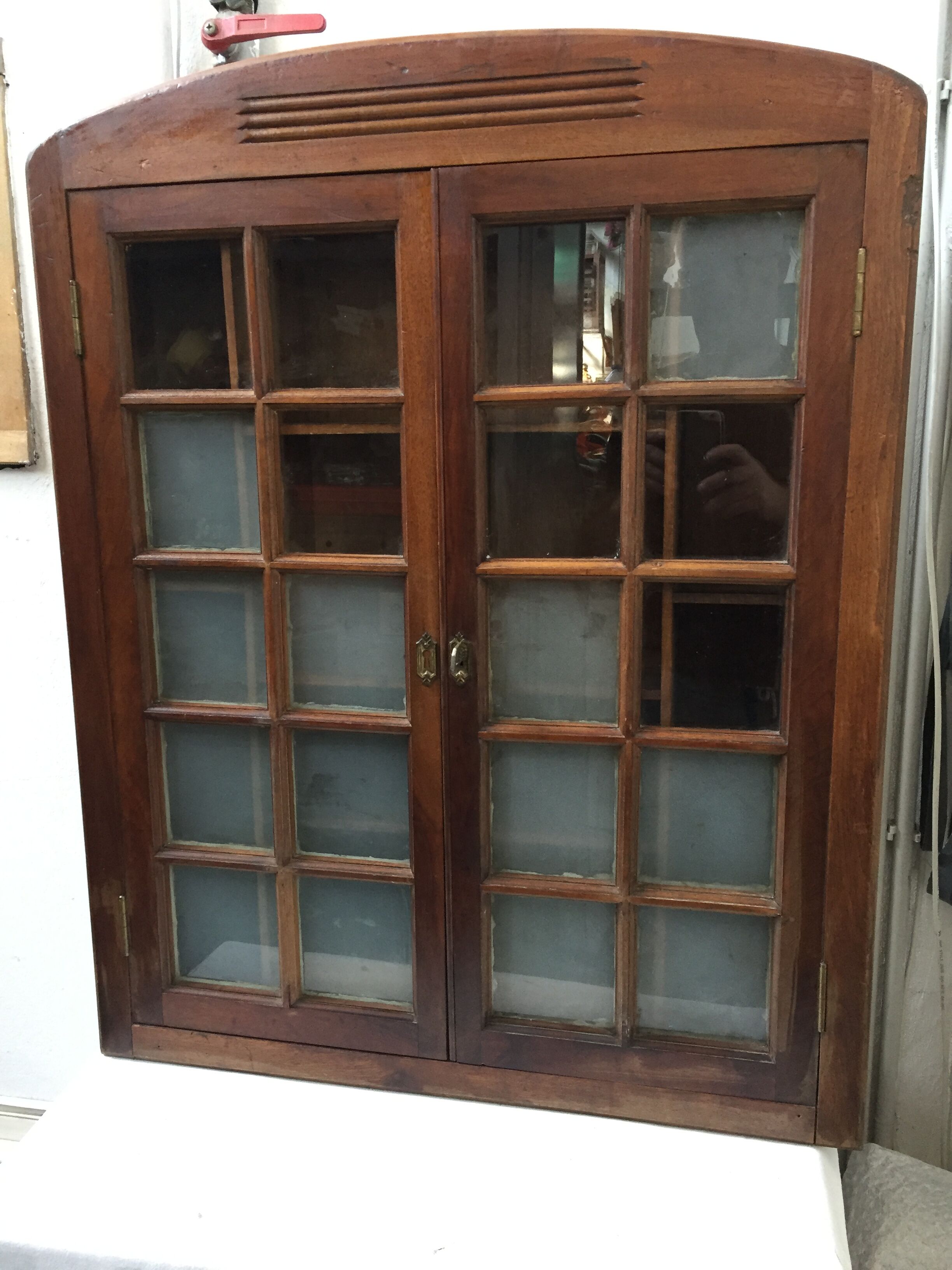 Old wall case has pharmacy
