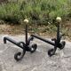 Massive wrought iron chenets from the 19th century topped with brass balls.
