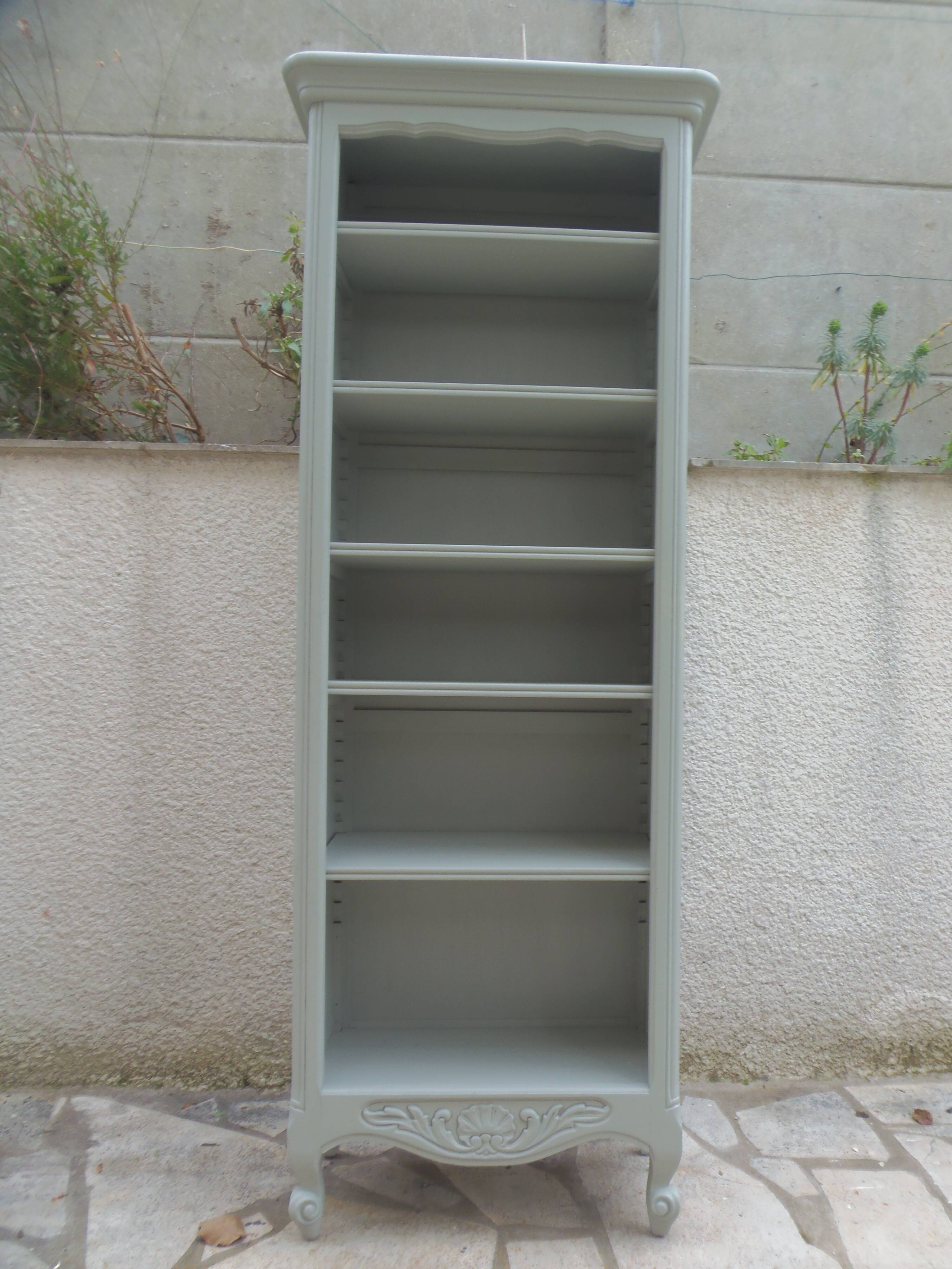 A shallow vintage bookcase re-enchanted in a verdigris finish.