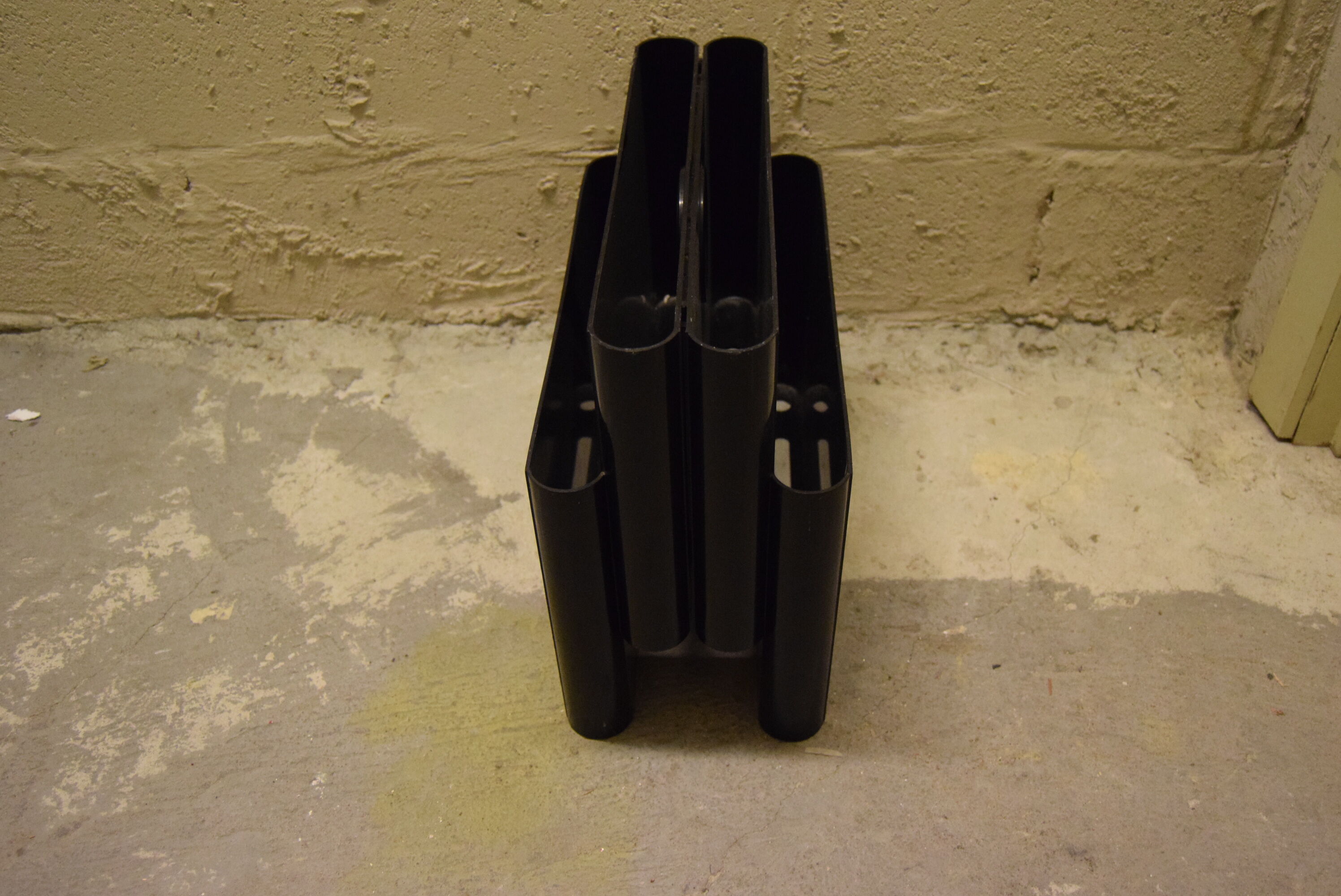 Kartell magazine holder by Giotto Stoppino