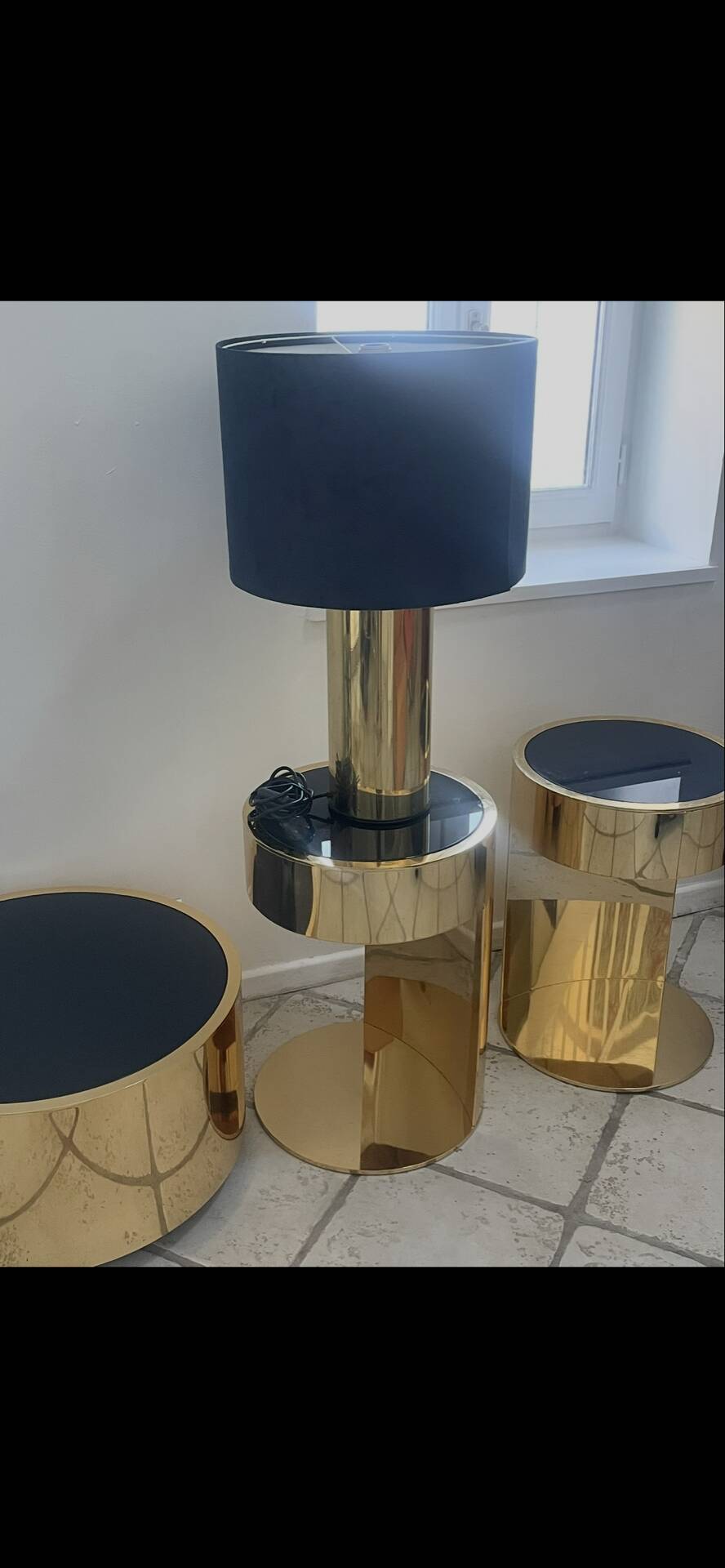2 bedside tables and a brass Fendi table.