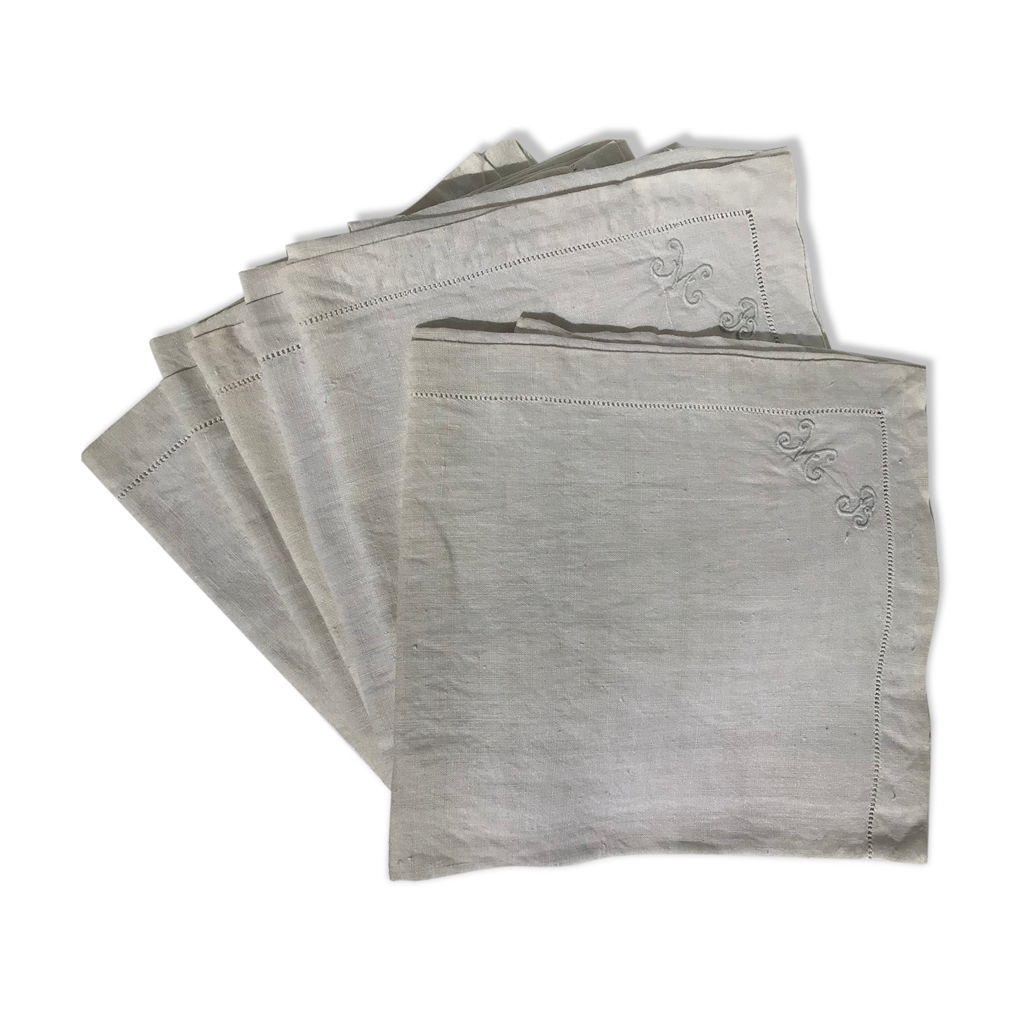 6 square linen napkins with hand-embroidered initials in the corner.