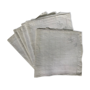6 square linen napkins with hand-embroidered initials in the corner.