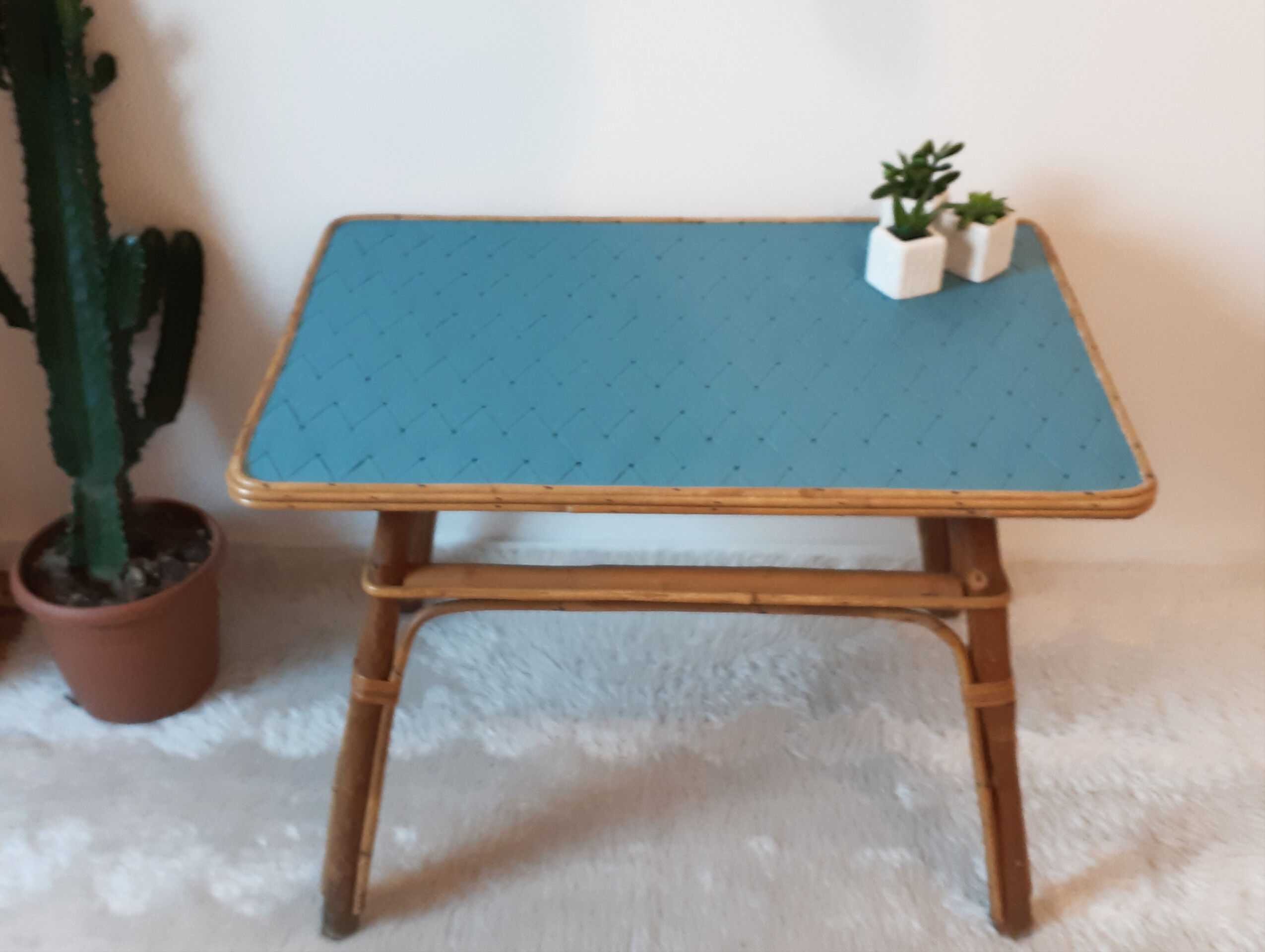 Coffee table in blue rattan