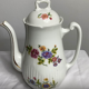 Antique porcelain teapot and sugar bowl