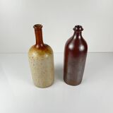 Duo of speckled stoneware and burgundy bottles, 20th century