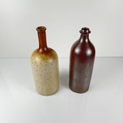Duo of speckled stoneware and burgundy bottles, 20th century