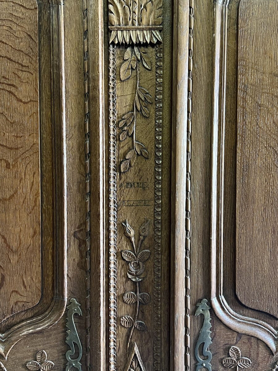19th-century Norman wedding armoire, with bouquets of flowers and doves.