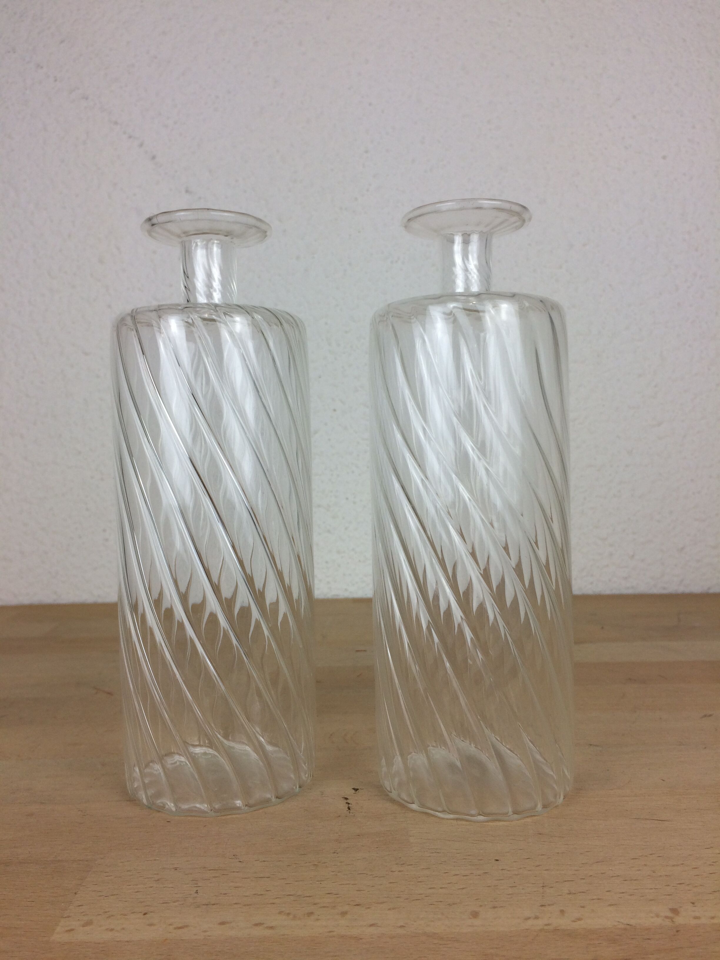 Pair of twisted glass bathroom bottle bottles