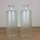 Pair of twisted glass bathroom bottle bottles