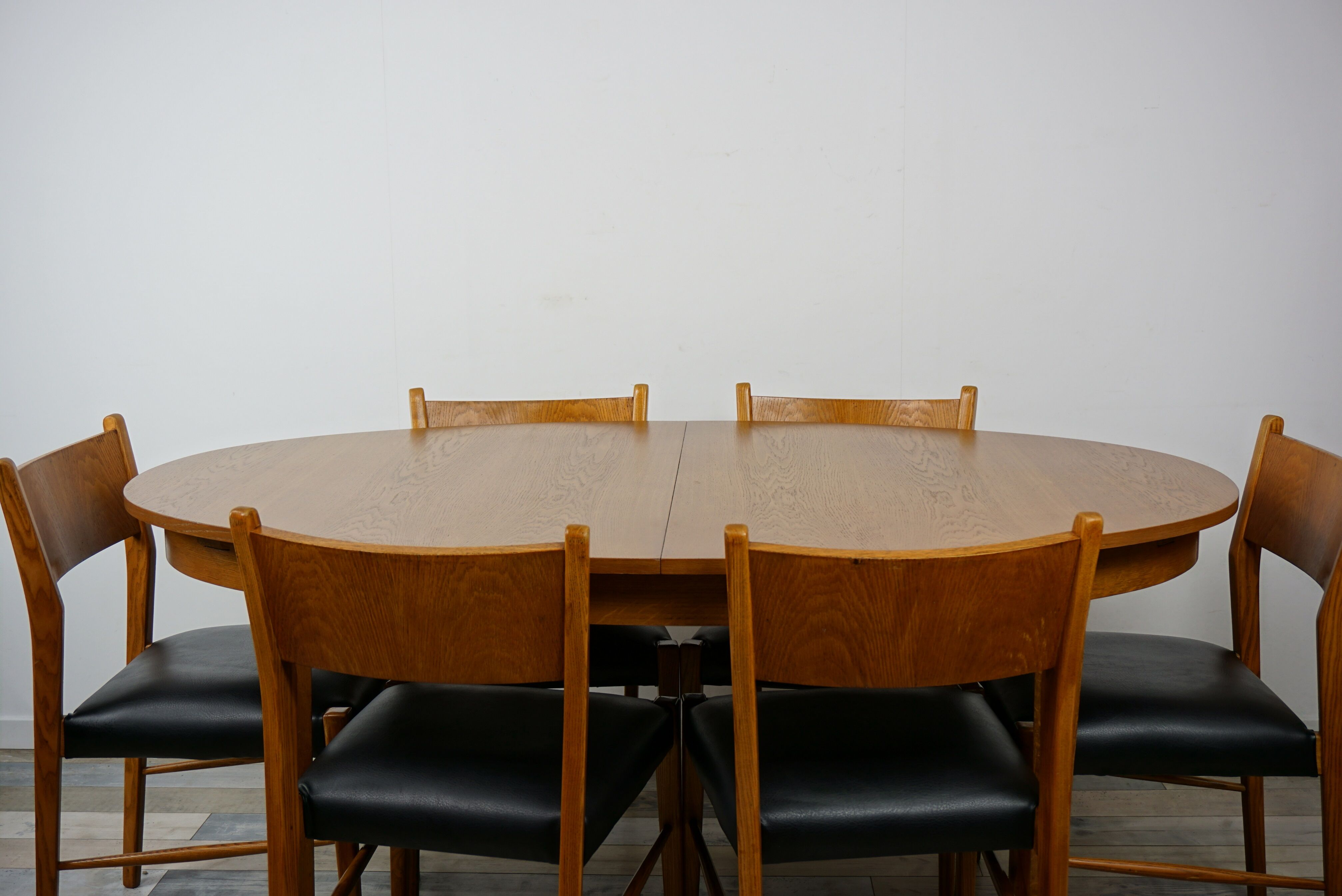 Wooden oval table and 6 matching chairs 60