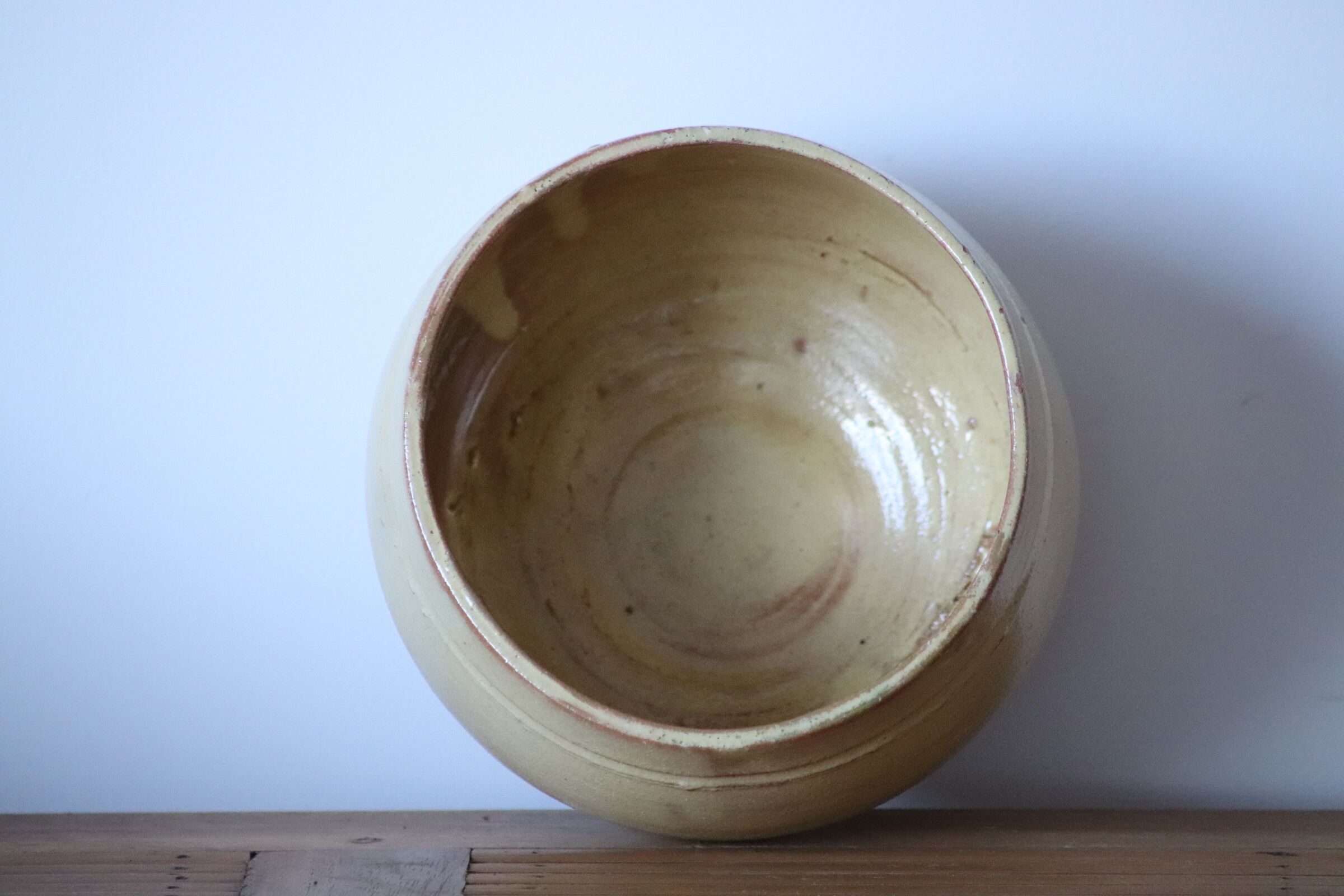 Ball vase in pale yellow glazed sandstone