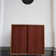 decorative midcentury cabinet with brass legs