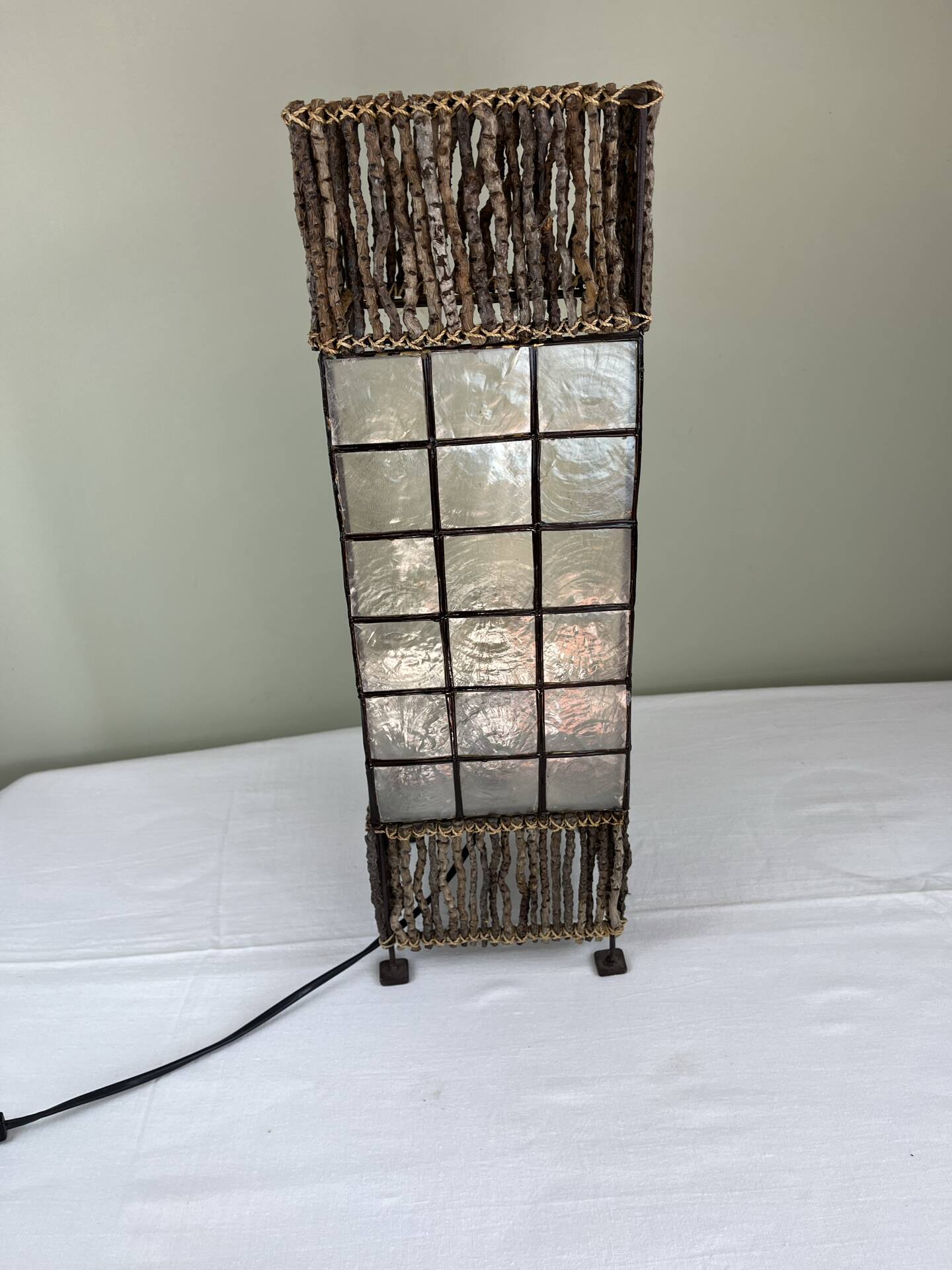 Capiz shell lamp and woven twigs